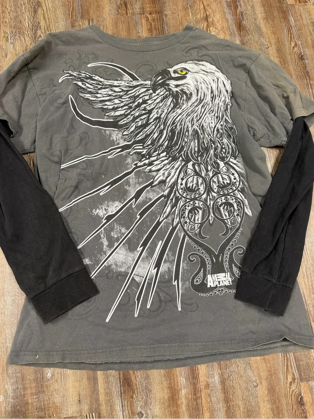 Y2K long sleeve shirt with white eagle graphic with tribal-style designs and lig